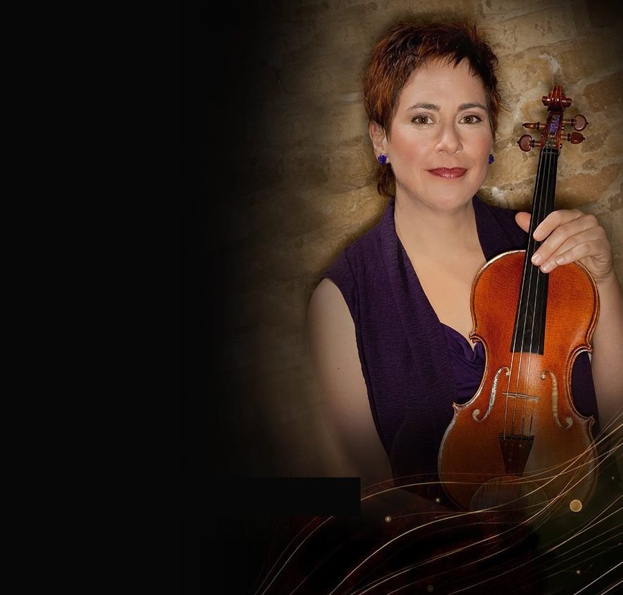 Concert violinist Dylana Jenson holding her violin, from the website we designed