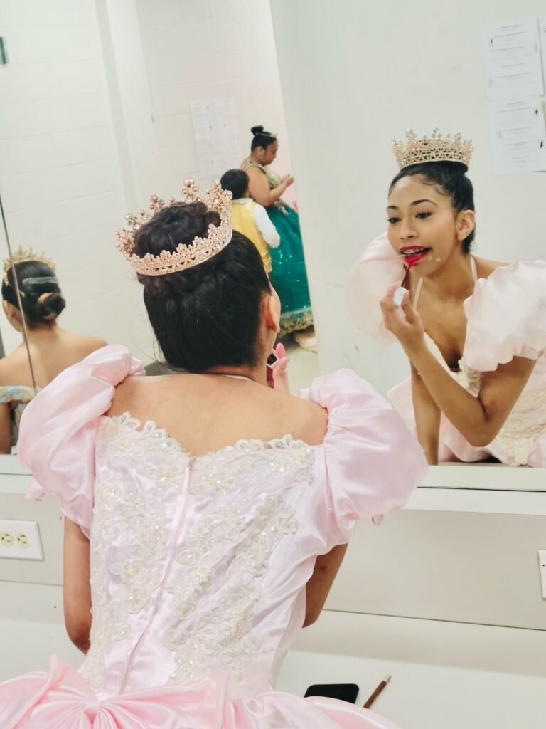 Karina's School of Dance dancers getting ready in front of the mirror before a show